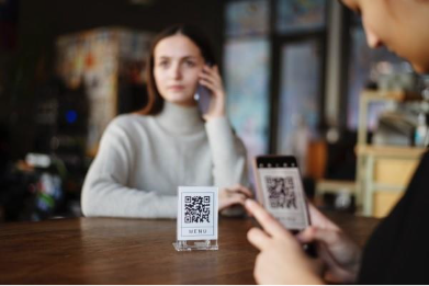A person on the phone and a bar code

AI-generated content may be incorrect.